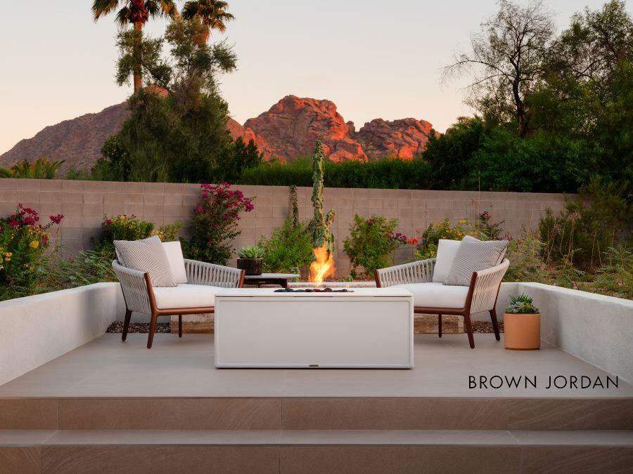 Modern outdoor patio featuring white cushioned lounge chairs in Dublin, OH
