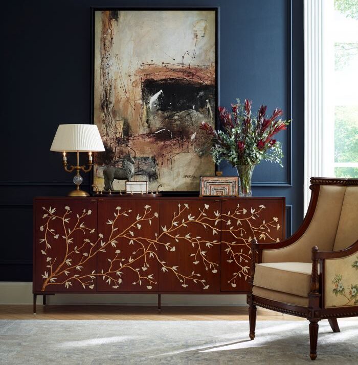 Ornately carved wood dining chairs beside a glossy table in Central Ohio